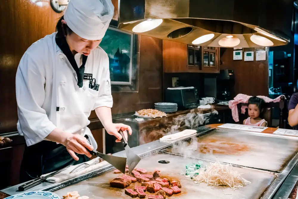 a japanese chef cooking kobe beef